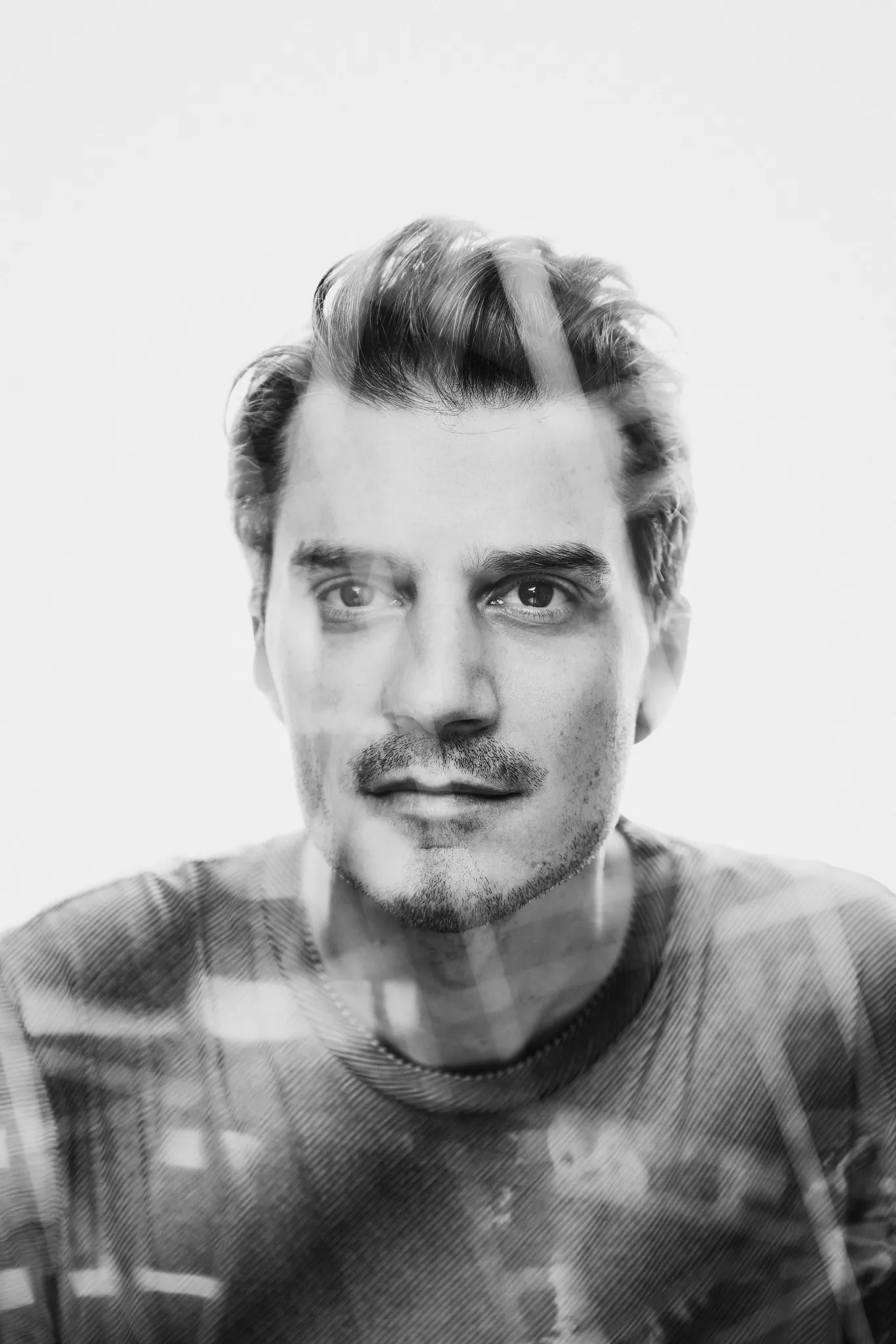 A black-and-white double exposure of Sven’s face.