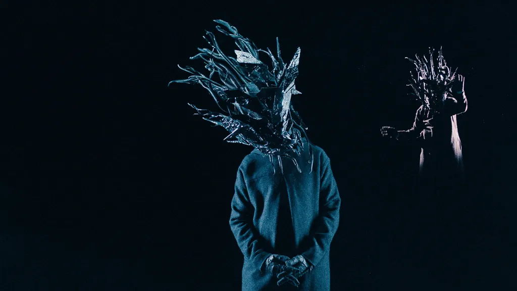 Chaos in blue, hands clasped, with a smaller copy reaching out behind him.