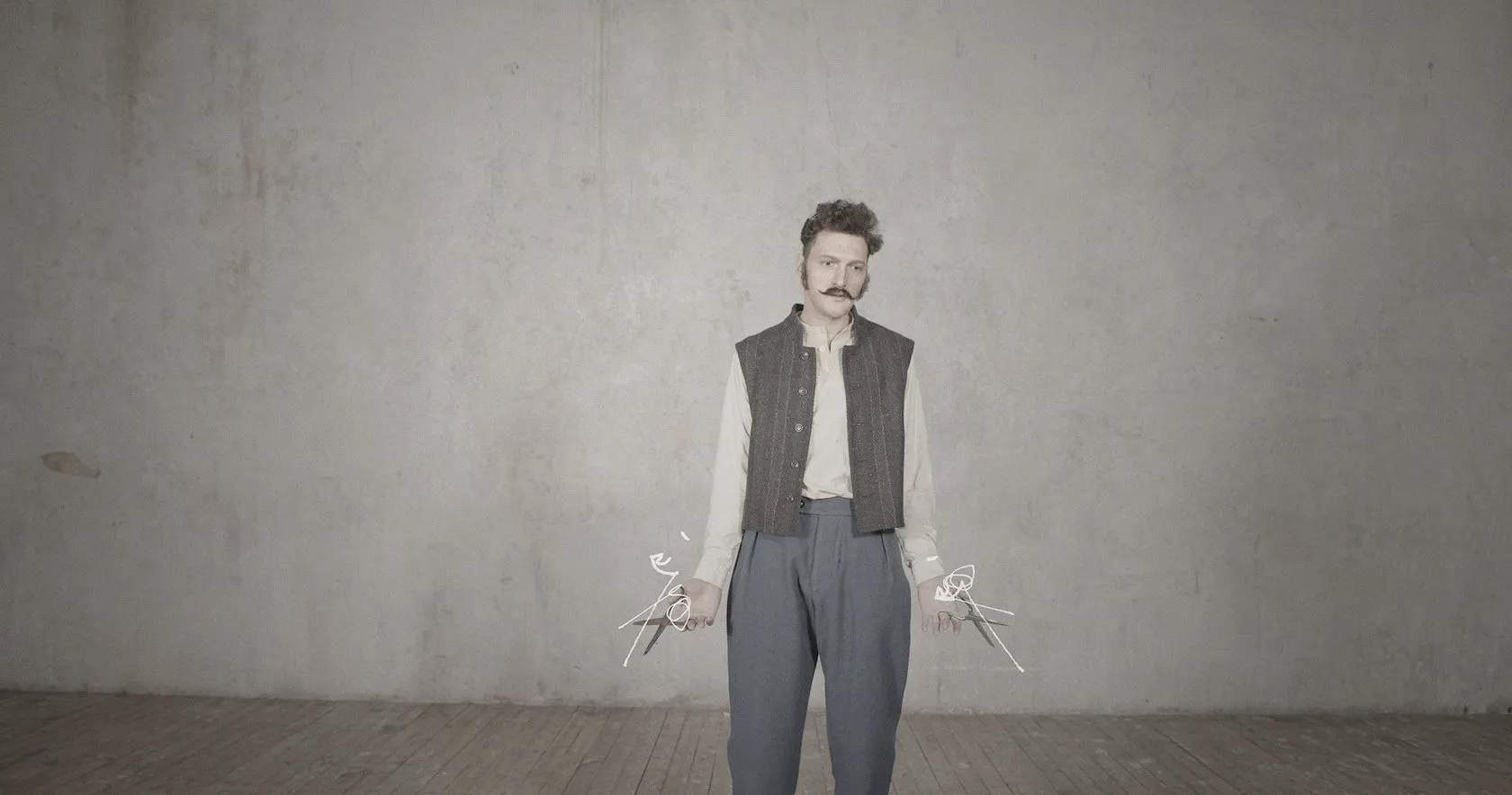 A man in a waistcoat stands with arms down, drawn scissors in both hands.