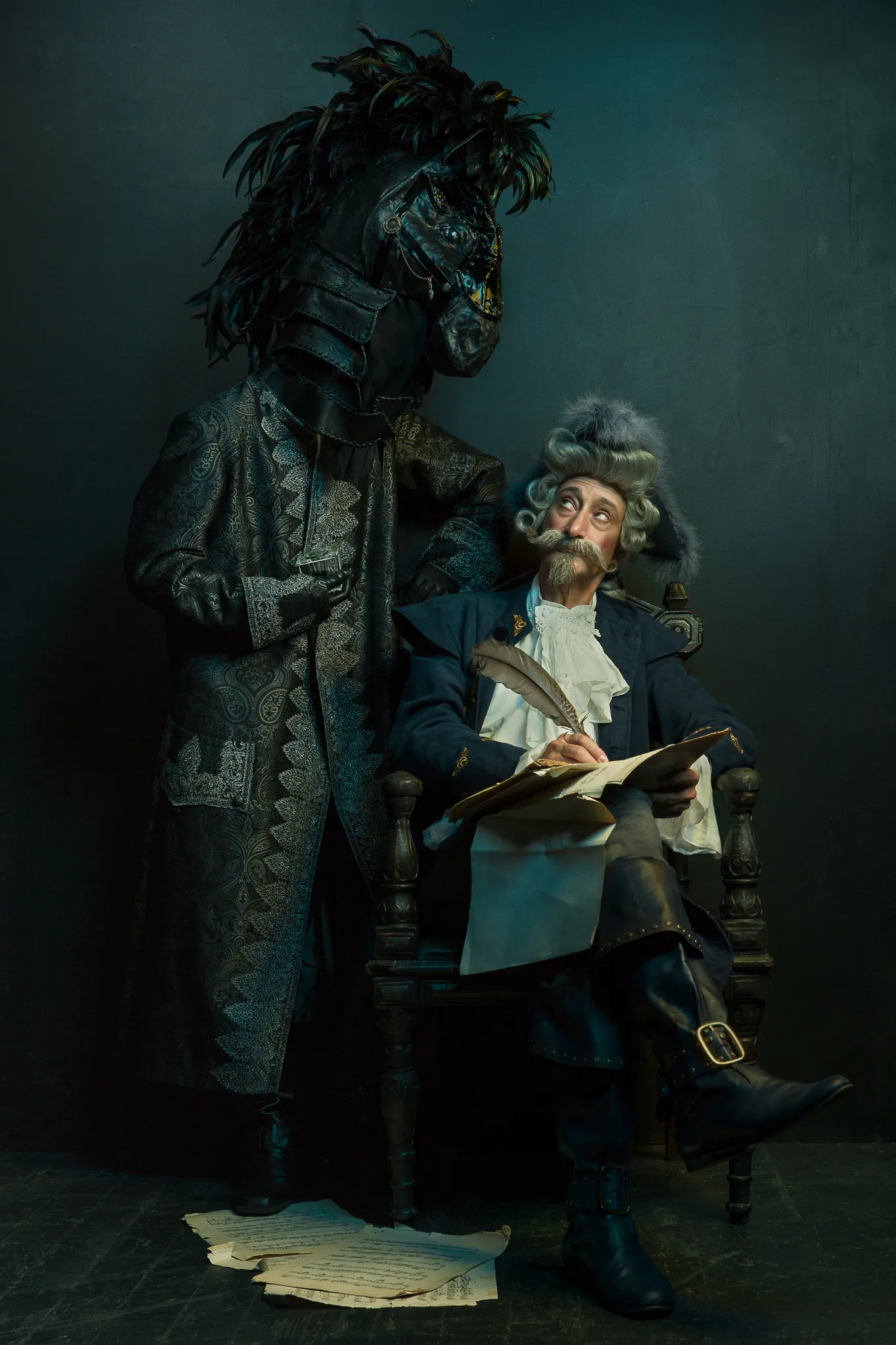 The Baron writes with a quill as a horse-headed figure in a brocade coat looks over his shoulder.