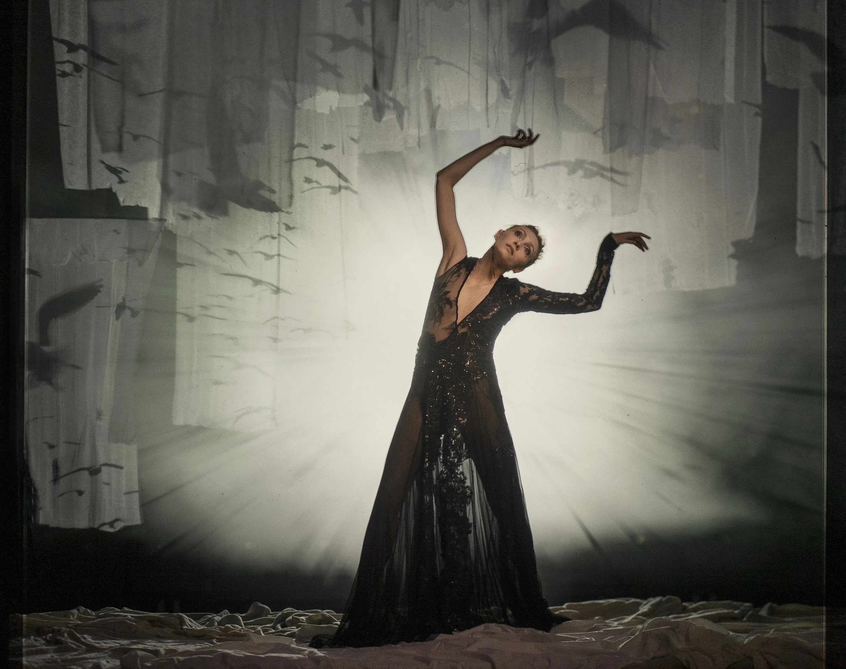 The Seagull poster by Andrei Kovalev: an actress in a flowing dark gown strikes a dramatic pose in misty light.
