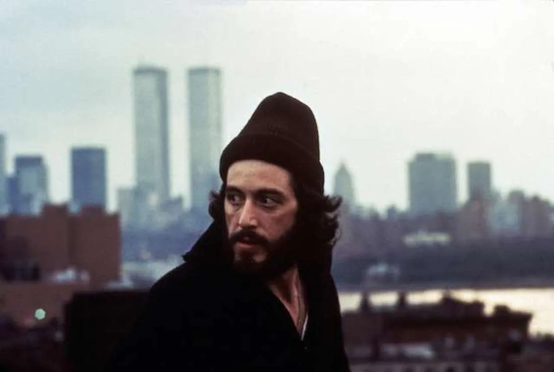 Reference: a bearded man in a knit cap against a 1970s New York skyline.