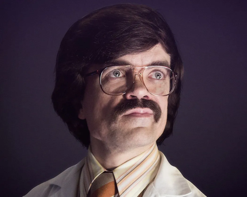 Reference: a man with a moustache, large glasses and a striped tie.