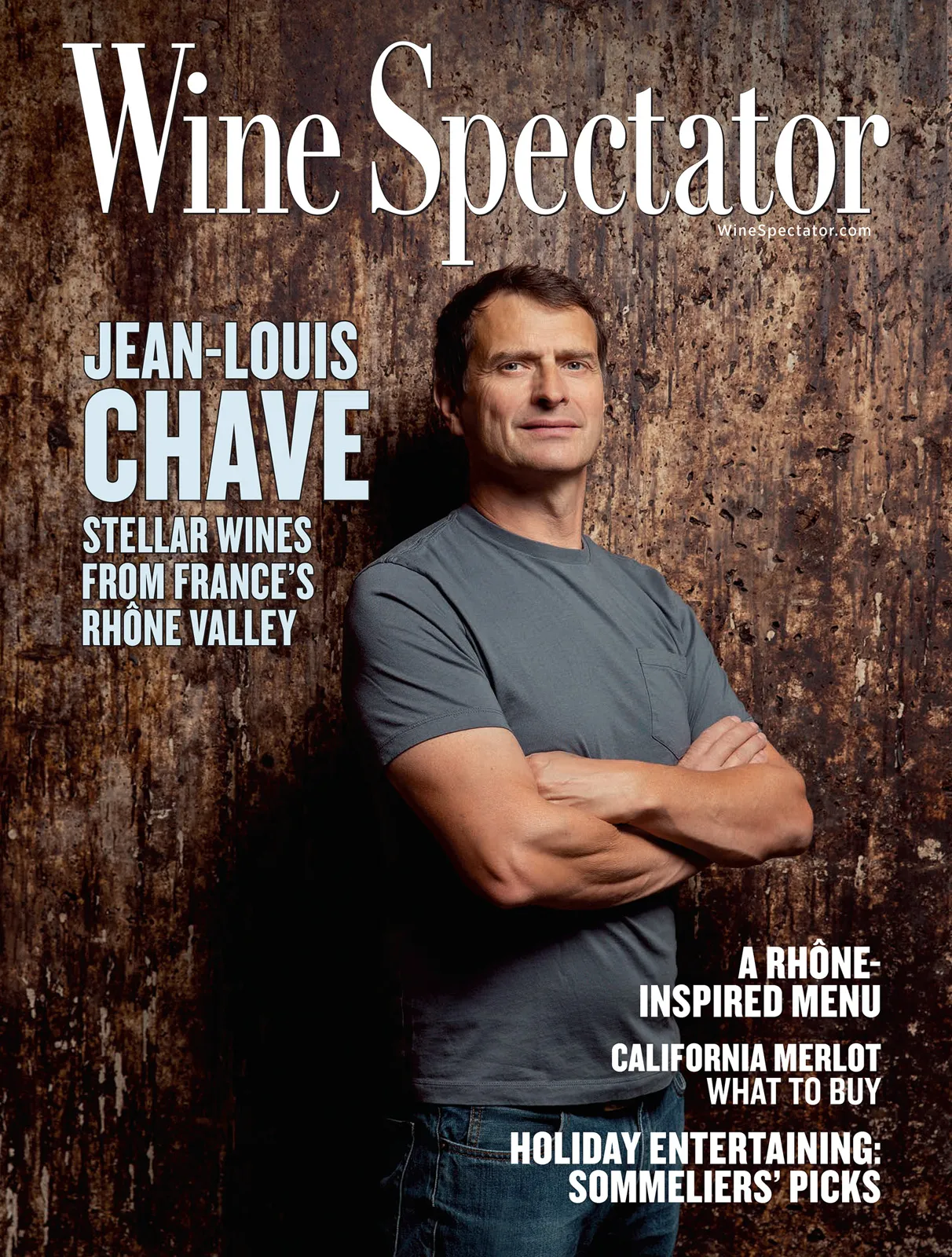 Jean-Louis Chave, arms crossed against a weathered wall, on the November 2019 cover of Wine Spectator.