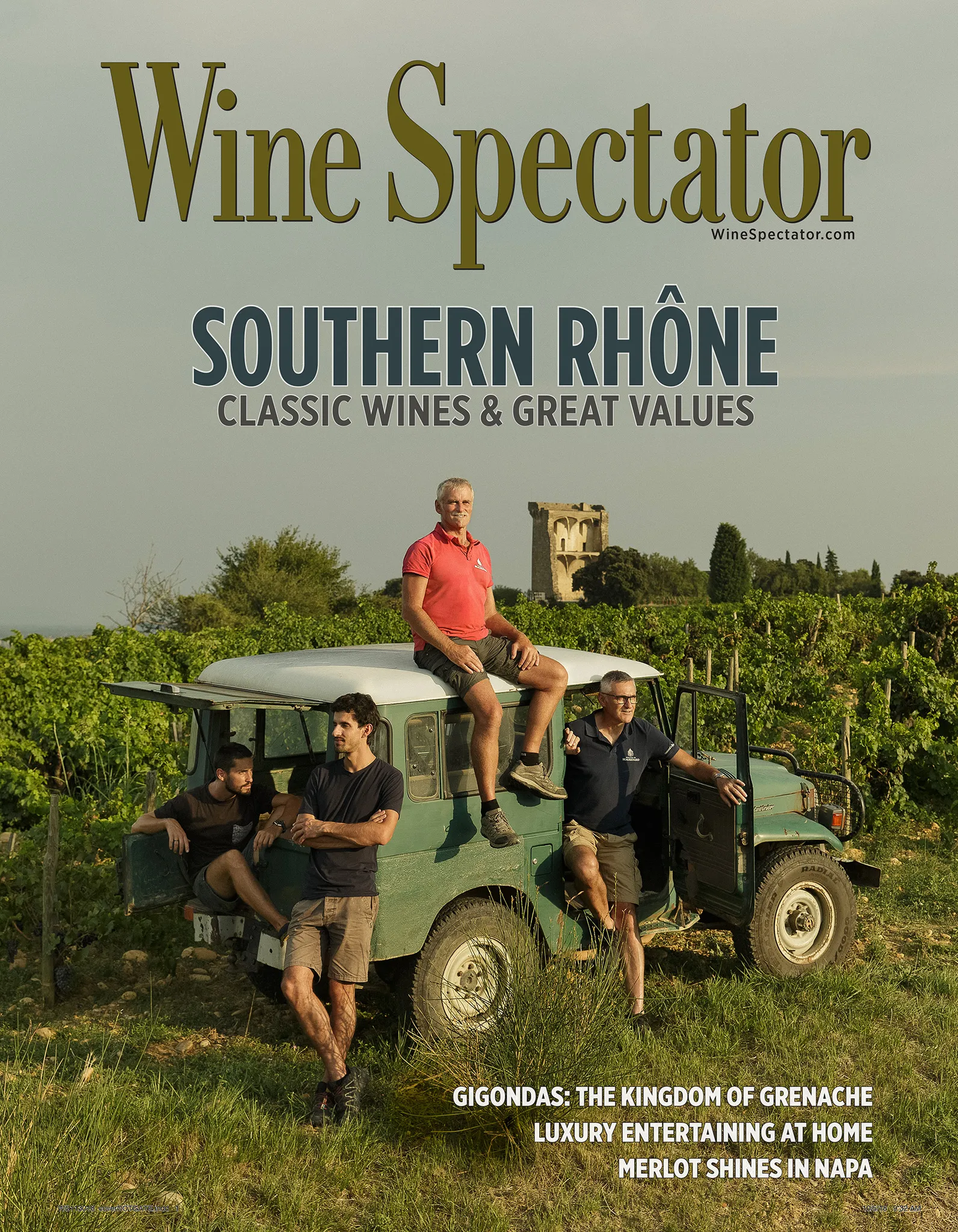The Coulon family of Domaine Beaurenard on an old jeep in their vineyard, on the cover of Wine Spectator.